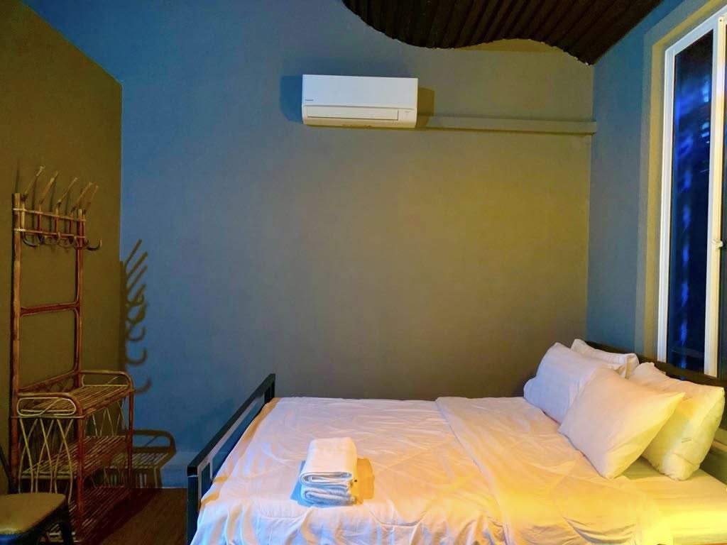 Light-filled guest room at Mama Sa